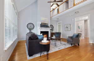 a clean and spacious living room with sofa and modern decor